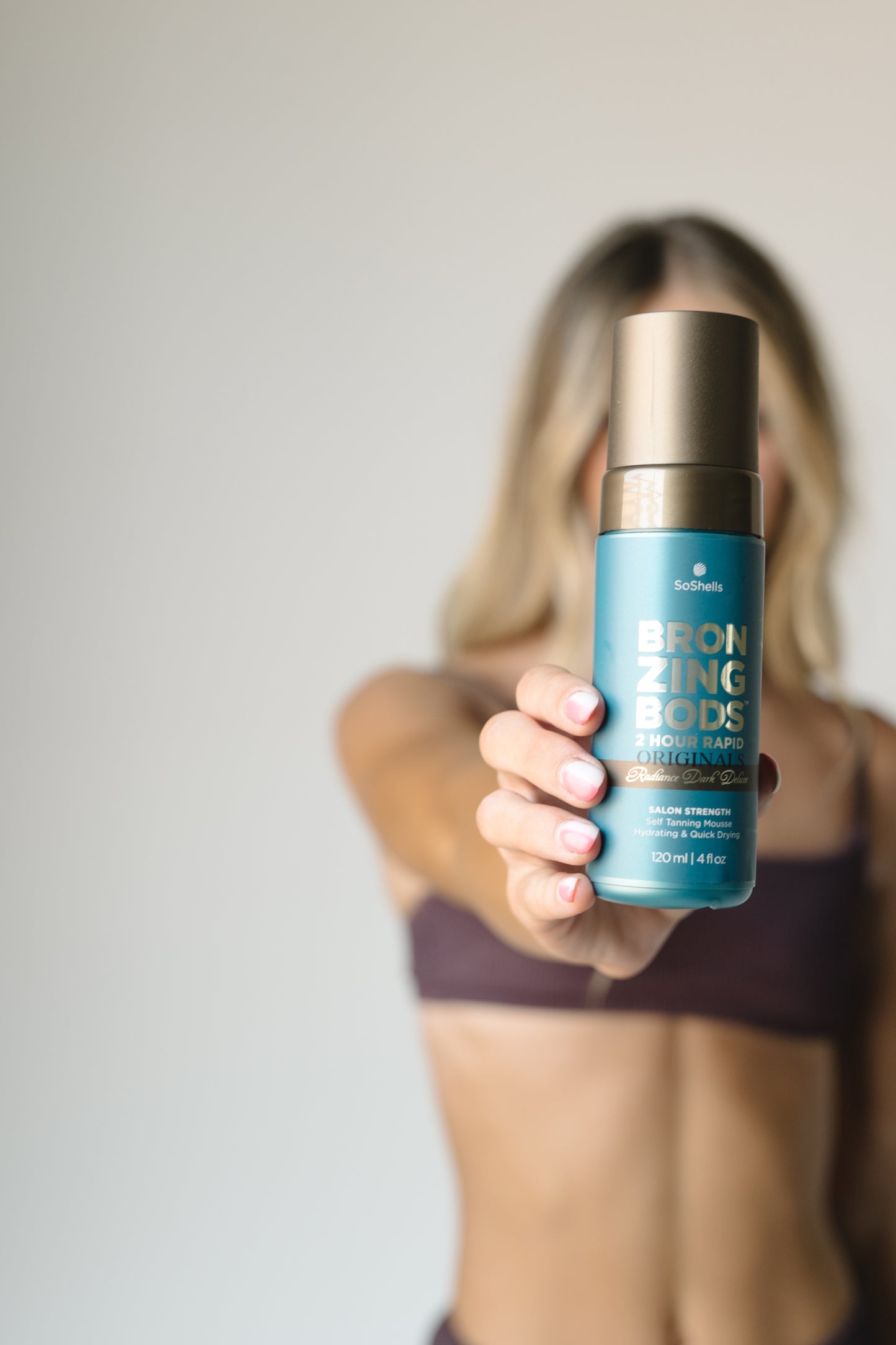 Close‑up of Bronzing Bods 2‑hour Ultra‑Dark mousse bottle – cruelty‑free & Australian made icons