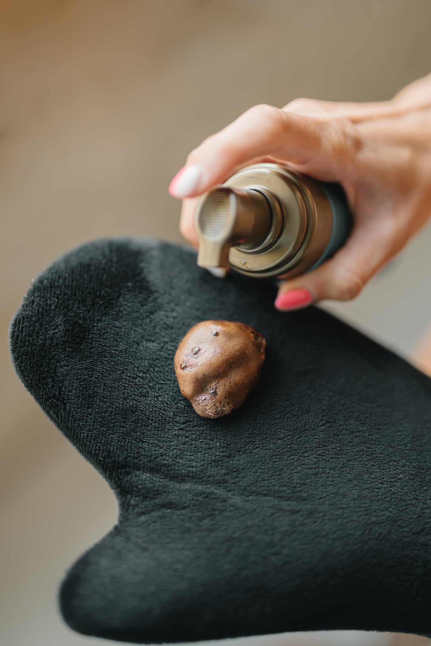 Rich, quick‑dry mousse texture of Bronzing Bods 2‑hour Ultra‑Dark tan on applicator mitt
